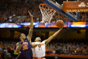 K.J. McDaniels blocks Tyler Ennis' shot in the first half. Syracuse defeated Clemson 57-44 Sunday night at the Carrier Dome. 