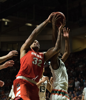 Dajuan Coleman fights for a rebound against Miami on Saturday. The Orange let another game slip away late, this time against No. 13 Miami in a chance for a signature win.