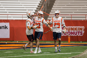 Syracuse players converge in last year's matchup with Colgate.