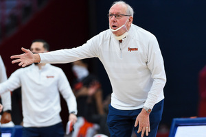 Jim Boeheim wearing a clear mask on the sidelines during the game against Buffalo.