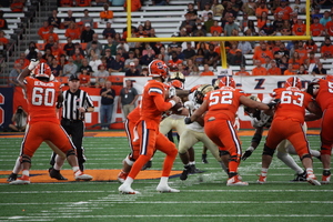 Garret Shrader rushed for 195 yards and four touchdowns while Syracuse's defense forced four turnovers in its third win of the season. 