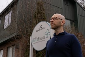 David Haas in front of Sarah's Guest House, a nonprofit that supports patients and their loved ones dealing with medical issues.