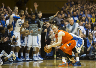 Trevor Cooney looks down the court after a battle for a loose ball. 