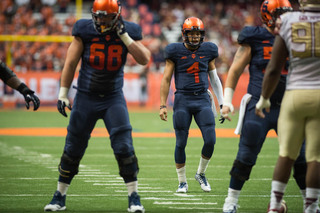 Freshman quarterback AJ Long walks up to the line of scrimmage during his convincing performance against the Seminoles. Long threw two touchdowns, both to fellow freshman Steve Ishmael. 