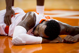 Christmas lies on the floor after taking a hard fall on a dunk attempt. Jim Boeheim ran out to check on him, and Christmas would be OK.