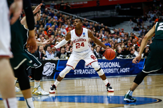 Buddy Hield (24) works his way around MSU's defense, looking to score for the Sooners.