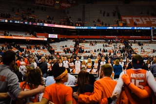 Fans recite the alma mater.