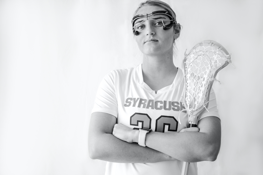 Sarah Cooper's lacrosse stick resting in her hands